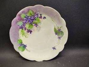 lot 20 image: Hand-painted Limoges Porcelain Plate featuring a Violet Floral Motif.
