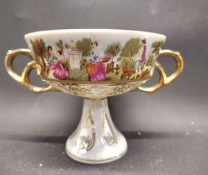 lot 56 image: Royal Sealy Lusterware Teacup With Courting Print and Opalescent finish