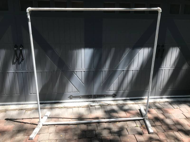 lot 54 image: Cloths rack made from pipe.   All in one piece-does not come apart