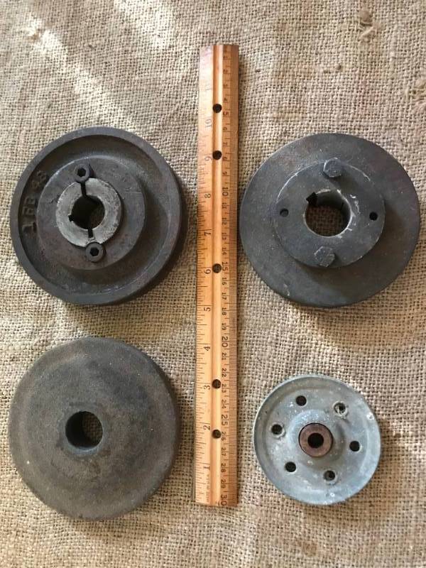 lot 80 image: Rustic Pulleys and grinding wheel