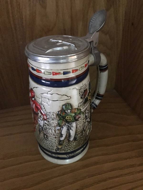 lot 116 image: Collectible Vintage Avon Sporting Stein Decanter (football theme)--good condition.  Numbered #325232