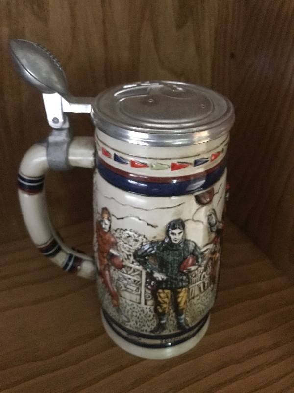 lot 117 image: Collectible Vintage Avon Sporting Stein Decanter (football theme)--good condition. Numbered #124395