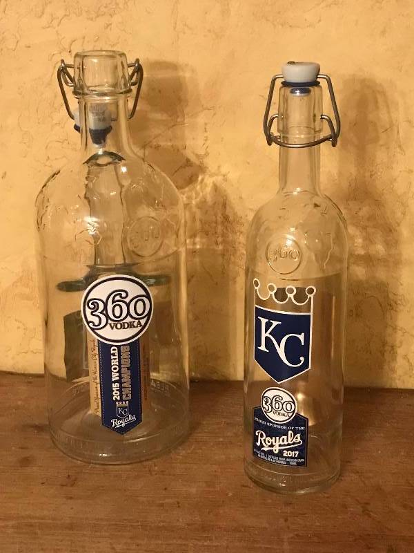lot 124 image: Set of 2 Glass 360 Kansas City Royals Bottles with flip tops (bail closure)--great bar dcor, chillin water or making Kombucha