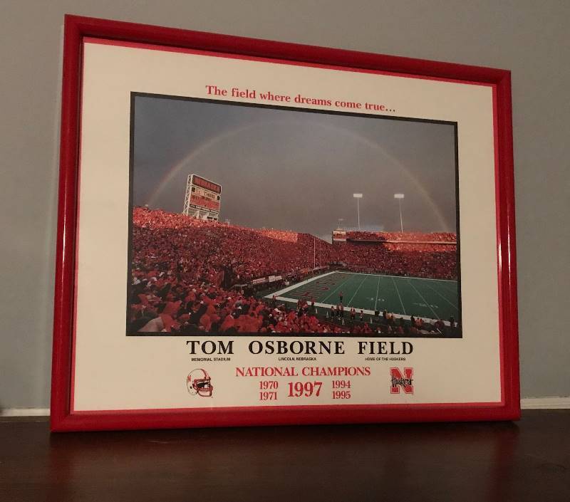 lot 164 image: Framed photo of Tom Osborne Field,  Memorial Stadium, Home of the Huskers, Lincoln Nebraska 1997 National Champions