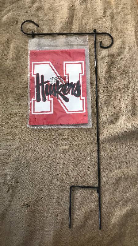 lot 169 image: Nebraska Huskers Garden Flag and Metal Stand