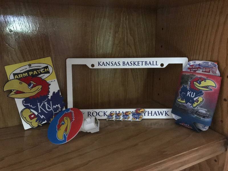 lot 204 image: Kansas University (KU) Jayhawk items (license plate holder, night light, can cozy, Jayhawk patch)