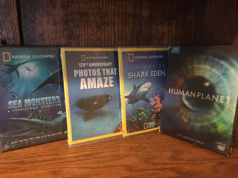 lot 2004 image: Set of Nature themed DVDs--Human Planet TV series and unopened National Geographic Photos that Amaze, Sea Monsters and Sharks
