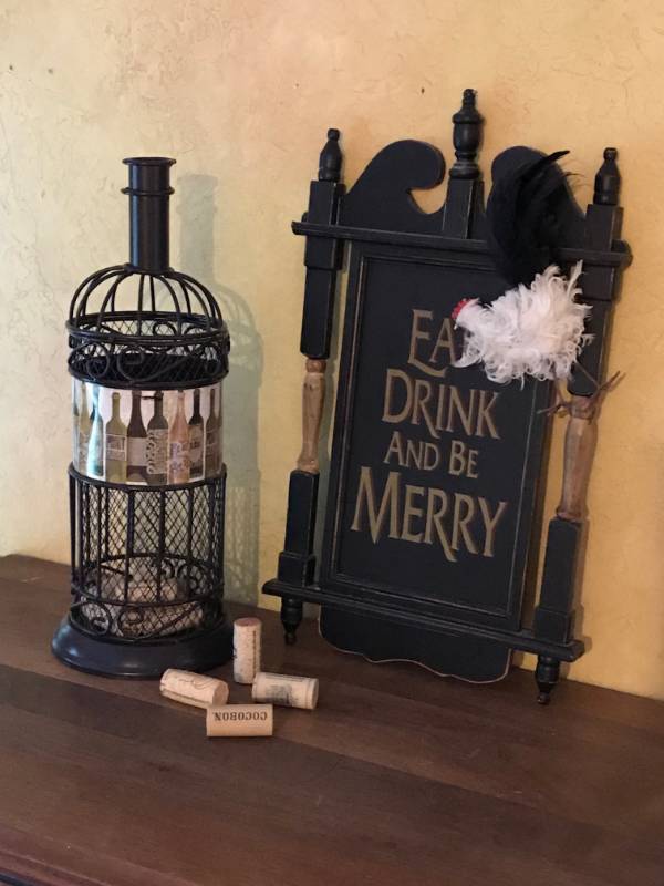 lot 2112 image: Eat Drink and Be Merry Wall Dcor and metal wine bottle cork holder