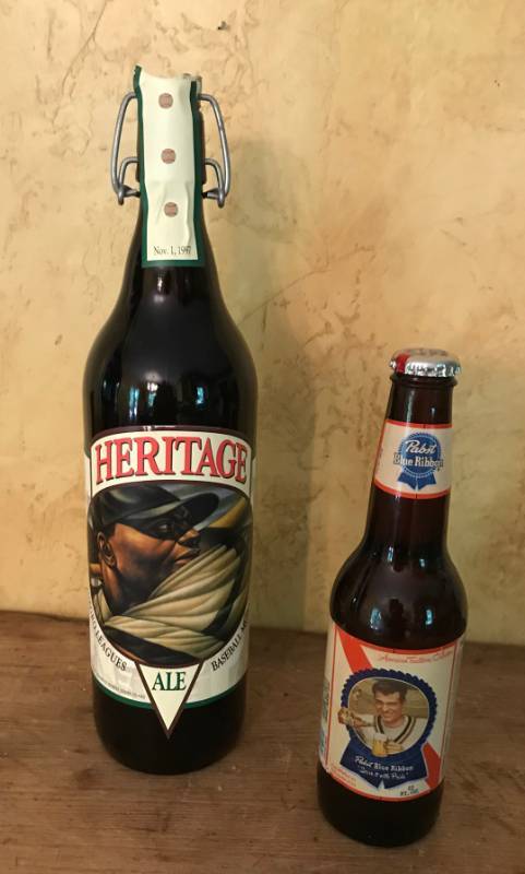 lot 2121 image: Collectible unopened bottles-Pabst Blue Ribbon American Traditions Collection (Tennis Player) and 1997 Coors Brewing Company Heritage Ale Saluting the Negro Baseball Leagues