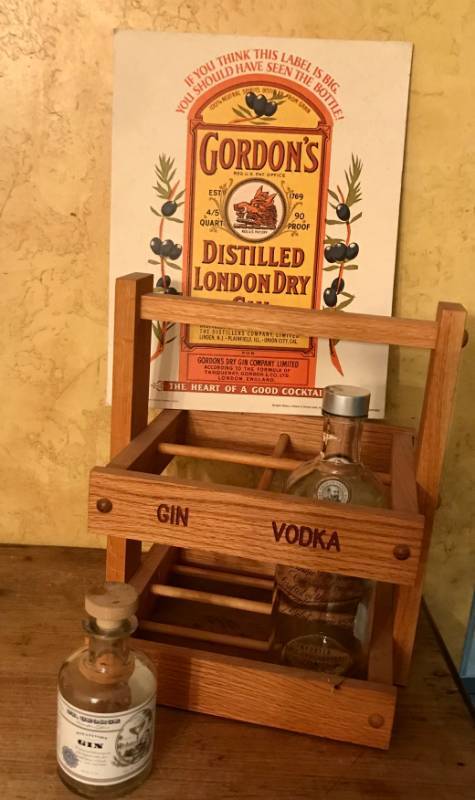 lot 2129 image: Wood bottle holdercrate  along with bottles and Gordon Gin Cardboard Advertisement (11 x 14)