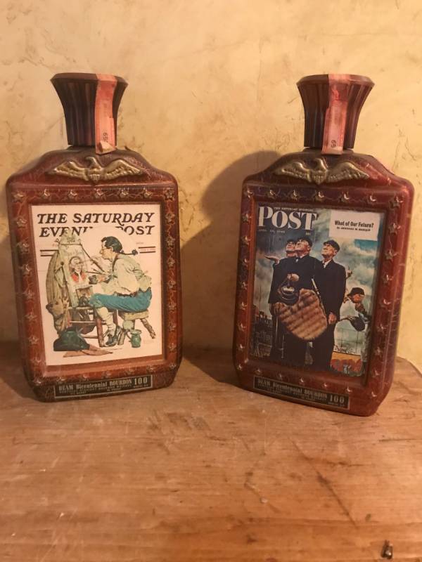 lot 2131 image: Set of 2 Collectible Saturday Evening Post Jim Beam Decanters