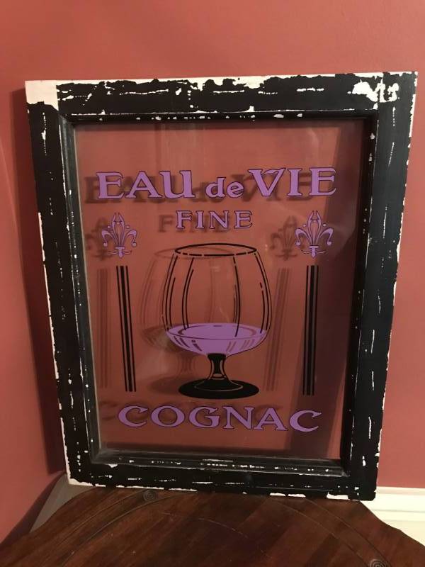 lot 2141 image: Distressed Black Wood Frame of Glass Eau de Vie Cognac Sign