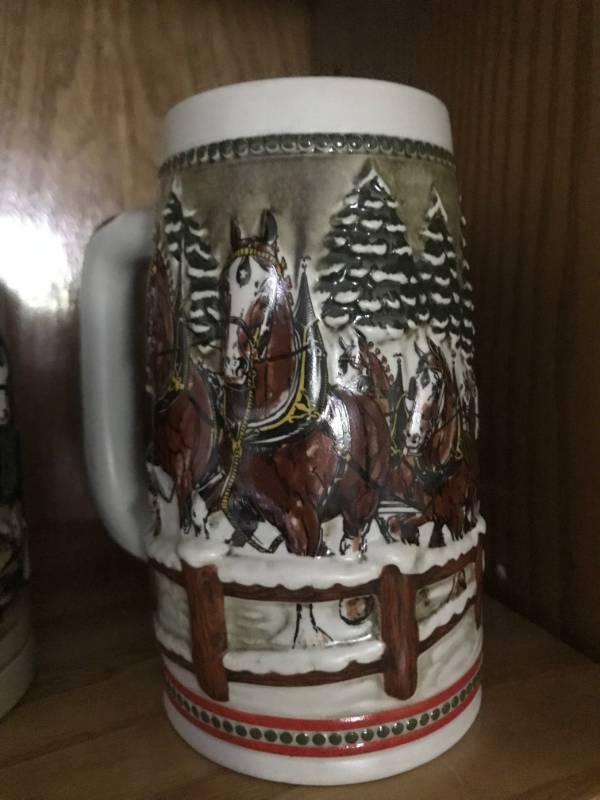 lot 2154 image: 1984 Budweiser Holiday Stein--Clydesdale hitch team passing through Covered Bridge by Anheuser Busch�