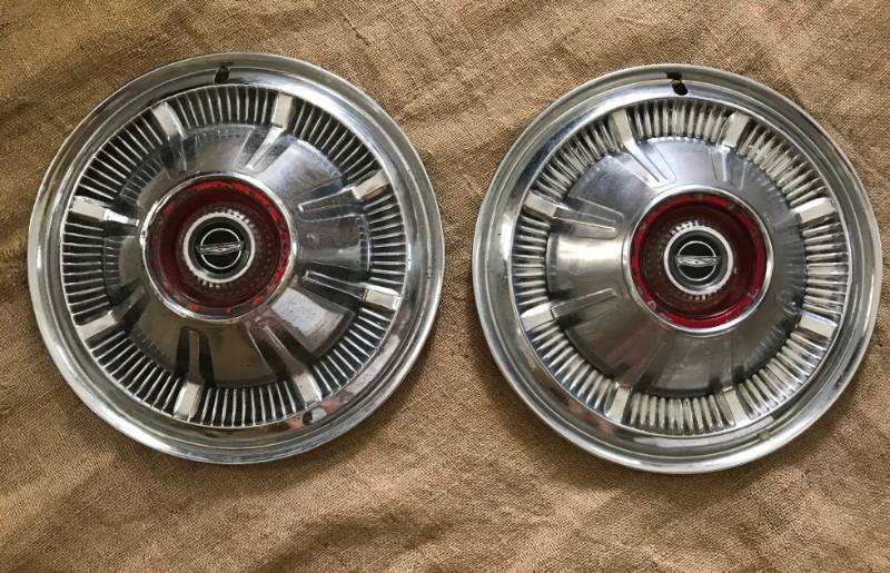 lot 2194 image: Set of 2 Vintage Ford Bronco, Truck, Van hubcap with red center emblem