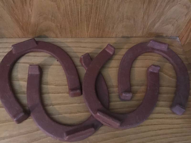 lot 2240 image: Set of 4 large red horse shoes