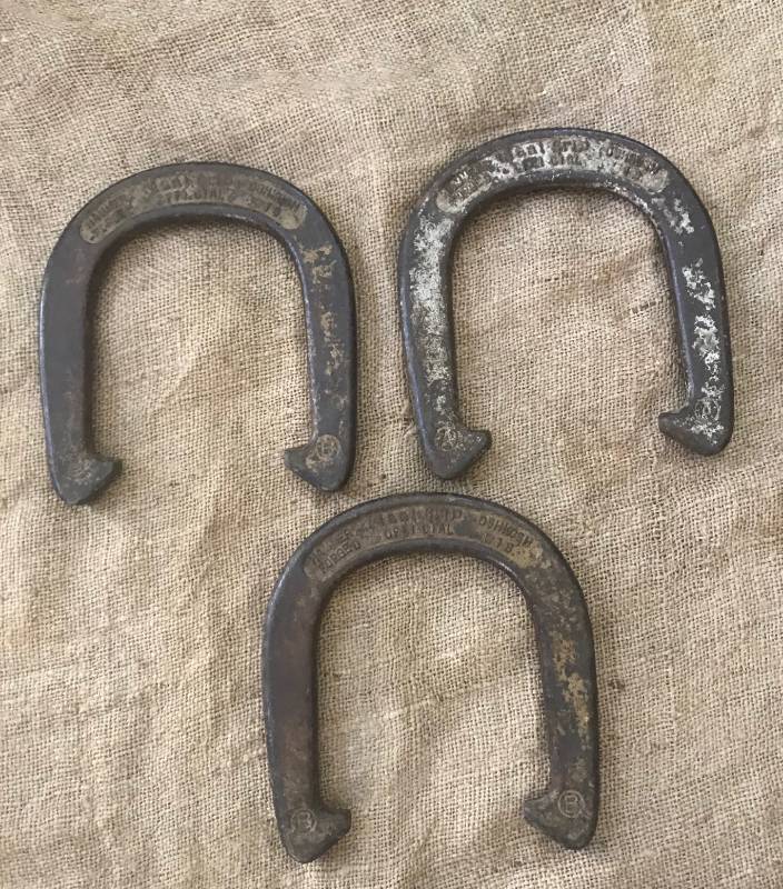 lot 2244 image: Set of 3 vintage hammered forged Oshkosh official horse shoes