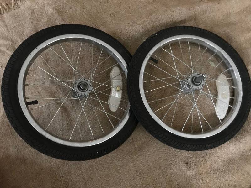 lot 2246 image: Wheels from stroller or cart 15 across