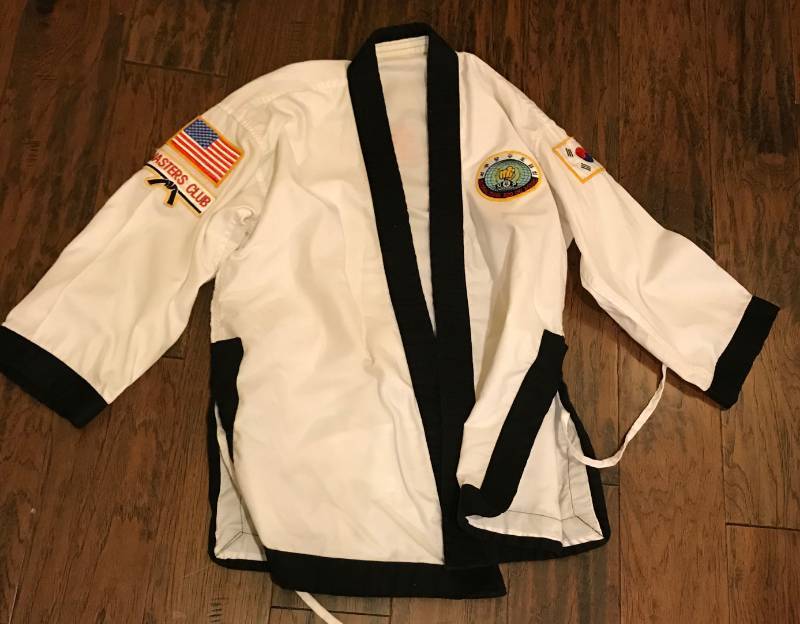 lot 2277 image: Children Size Karate Shirt with patches