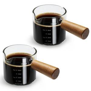 lot 246 image: 2 Pack Espresso Cups with Wood Handle, 75ML Double Spout Glass Measuring Cup with Dual Scale, Espresso Shot with V-Shaped Mouth, Clear Glass Espresso Accessories, Milk Frothing Pitcher - Retail $8