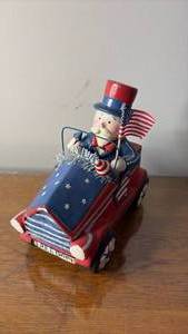lot 1057 image: Patriotic Uncle Sam Wagon Ceramic Decoration (approximately 8 inches tall)