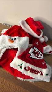lot 1064 image: Big Bundle Nice Plush Santa Hats including Kansas City Chiefs, Snowman and Extra Long