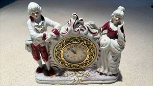 lot 1128 image: Charming Porcelain Figurine Clock Retrofitted with Battery Operated Clock (approximately 10 inches tall