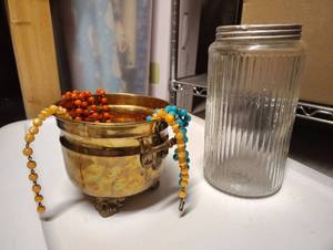 lot 3008 image: Vintage Bead Necklaces in Metal Footed Vase and Vintage Glass Jar w Lid