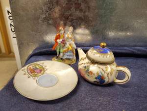 lot 3048 image: Courting Tea Pot and Saucer and Porcelain Figurine