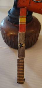 lot 829 image: Korea War Pin and Antique Spra well Bug Sprayer