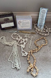 lot 723 image: Max Lucado Grace Perpetual Calendar - with Shell Necklaces