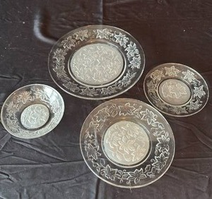lot 727 image: Clear Glass Poinsettia Plates Set (8) Dinner Plates (8) Salad Plates (8) Bread & Butter Plates and (8) Dessert Bowls