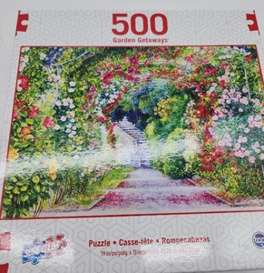 lot 68923 image: Garden Getaways 500 Piece Puzzle - Flower Archway Path - Retail $12