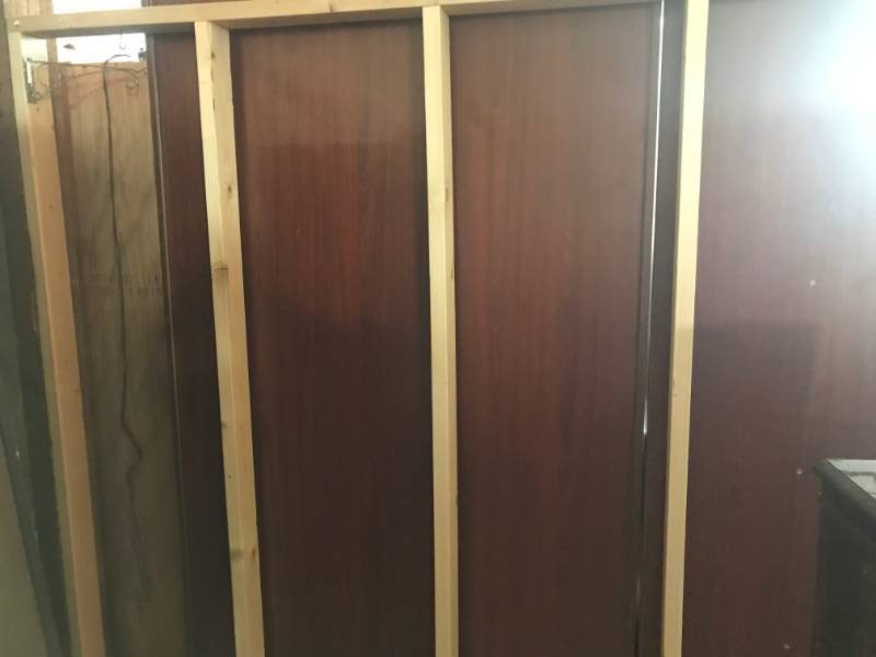 lot 5744 image: Aprox. 27 Movable Walls Made Of 2x4s and Slot Wall  Peg Board