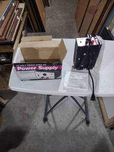 lot 827 image: Arista 12V DC Regulated Power Supply Model 46-482