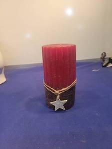 lot 5057 image: Red Pillar Candle with Star Charm