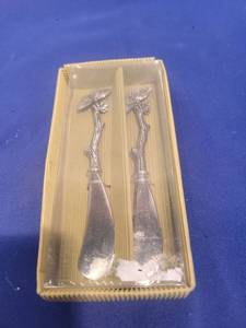 lot 5197 image: Winged Figure Metal Spoons Set