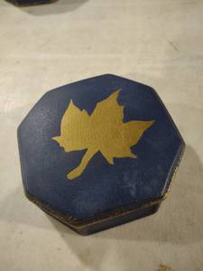 lot 5908 image: Navy Blue Octagonal Box with Gold Maple Leaf