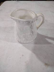 lot 5918 image: White Porcelain Creamer with Embossed Design