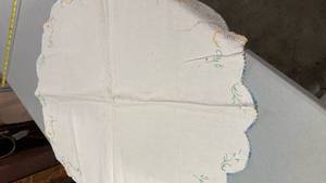 lot 6840 image: Embroidered White Linen Doily with Blue Trim 31 x 34��