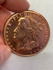 lot 19 image: 1 oz 999 Fine Copper Round Morgan Dollar design