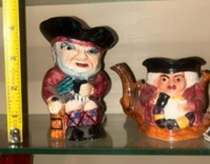 lot 55989 image: Staffordshire Toby Jugs and a matching Toby Jug Teapot made by Shorter & Son, Ltd in England. These are vintage, hand-painted ceramic collectibles. The design is a classic Toby style, which originated from a character named Toby Philpots in