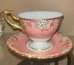 lot 55993 image: This is a Royal Crown Derby Vine Salmon (Pink) A767 cup and saucer set