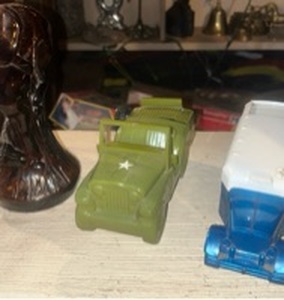 lot 60107 image: Avon Bucking Bronco cologne or aftershave bottle.  Army Jeep aftershave decanter. Avon 31 Greyhound Lines bus aftershave decanter.