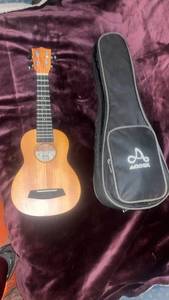lot 60304 image: Addek Concert Ukulele with Gig Bag and Strap