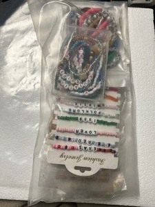 lot 26 image: Large Bundle of Taylor Swift Merch - Bracelets 20, bunch of Necklaces