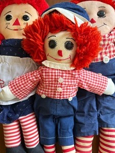 lot 216 image: Raggedy Ann and Andy Dolls, One is Two-Sided (one is missing an eye)