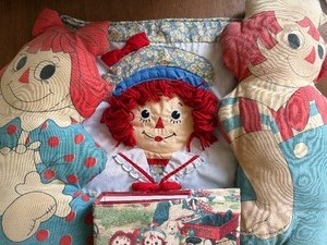 lot 225 image: Raggedy Ann and Andy Pillow Dolls, Pillow Sham and Photo Album