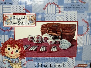 lot 199 image: Raggedy Ann and Andy 13 Piece China Tea Set in Basket, New in Package
