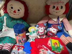 lot 241 image: Raggedy Ann and Andy Dolls, Thermos, Earring Holder, Magnets, Pins AND MORE