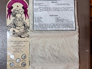 lot 48 image: Unique Christmas Pudding Pack  Sterling Coins, Recipe and Cloth